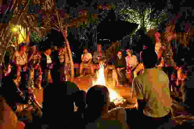 A Group Of People Gathered Around A Storyteller In An African Village African Mythology: Captivating Myths Of Gods Goddesses And Legendary Creatures Of Africa
