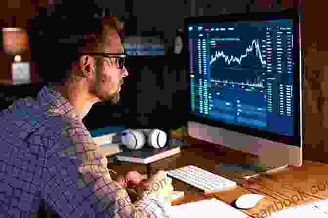 A Person Sitting At A Desk Working On A Computer With Financial Charts On The Screen. The Ultimate 101 Guide To Personal Finance : Step By Step Instructions On How To Take Back Control Of Your Finances