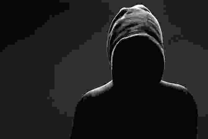 A Shadowy Figure Lurking In The Darkness, Its Face Obscured By A Hoodie. One Dark Night Hakim Wilson