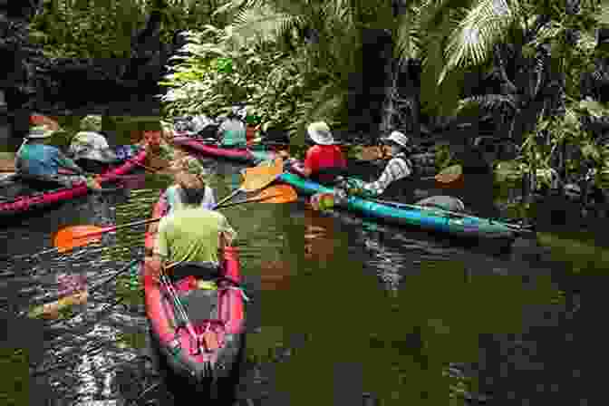 Dane Maddock Paddling A Canoe Through A Lush Amazonian River, Surrounded By Towering Trees And Vibrant Wildlife. The Dane Maddock Adventures Volume 1